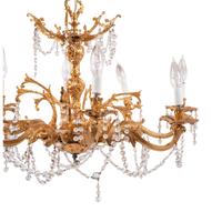 A Louis XV Style Gilt Metal and Cut-Glass Eight-Light Chandelier