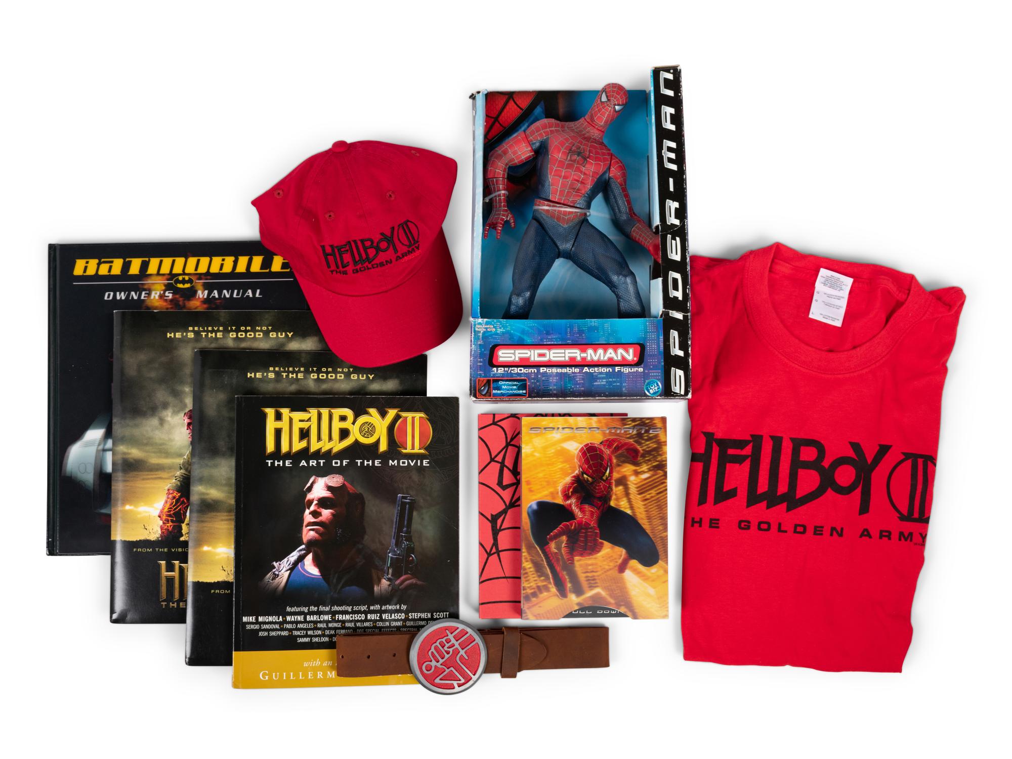 (Film Memorabilia) A group of 11 pieces of memorabilia from superhero movies, comprising: comprising:
