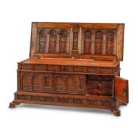 A Continental Carved Walnut Cassone
