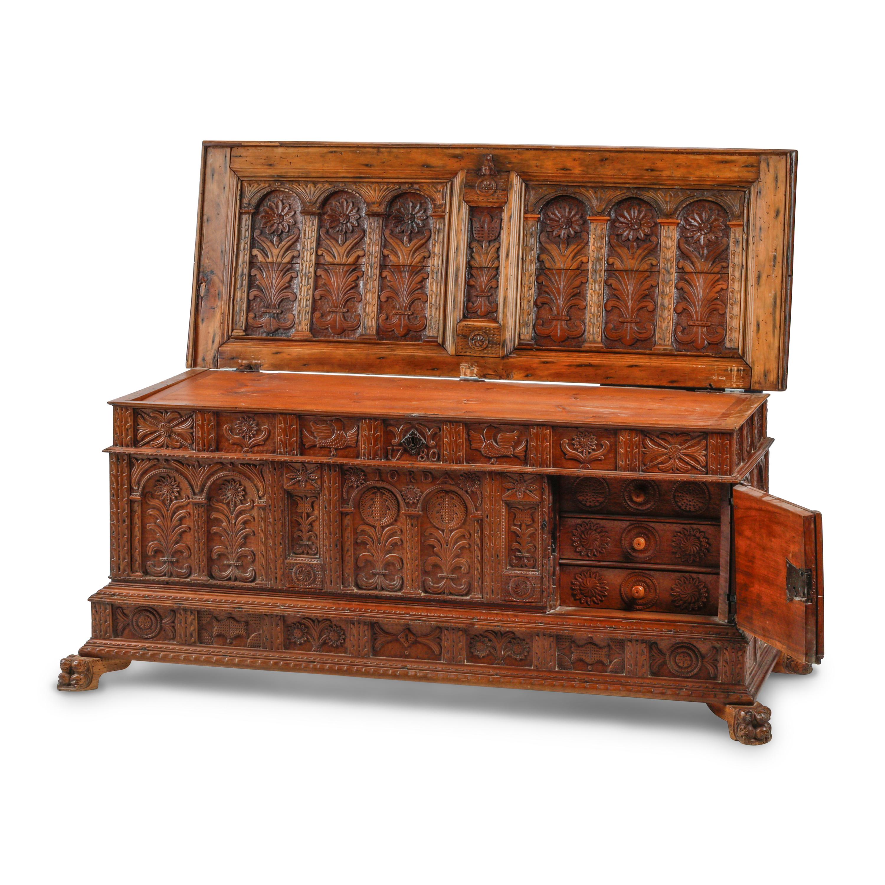 A Continental Carved Walnut Cassone