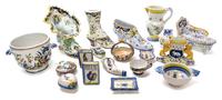 A Collection of Quimper Pottery Articles Height of tallest boot form vessel 7 3/4 inches.
