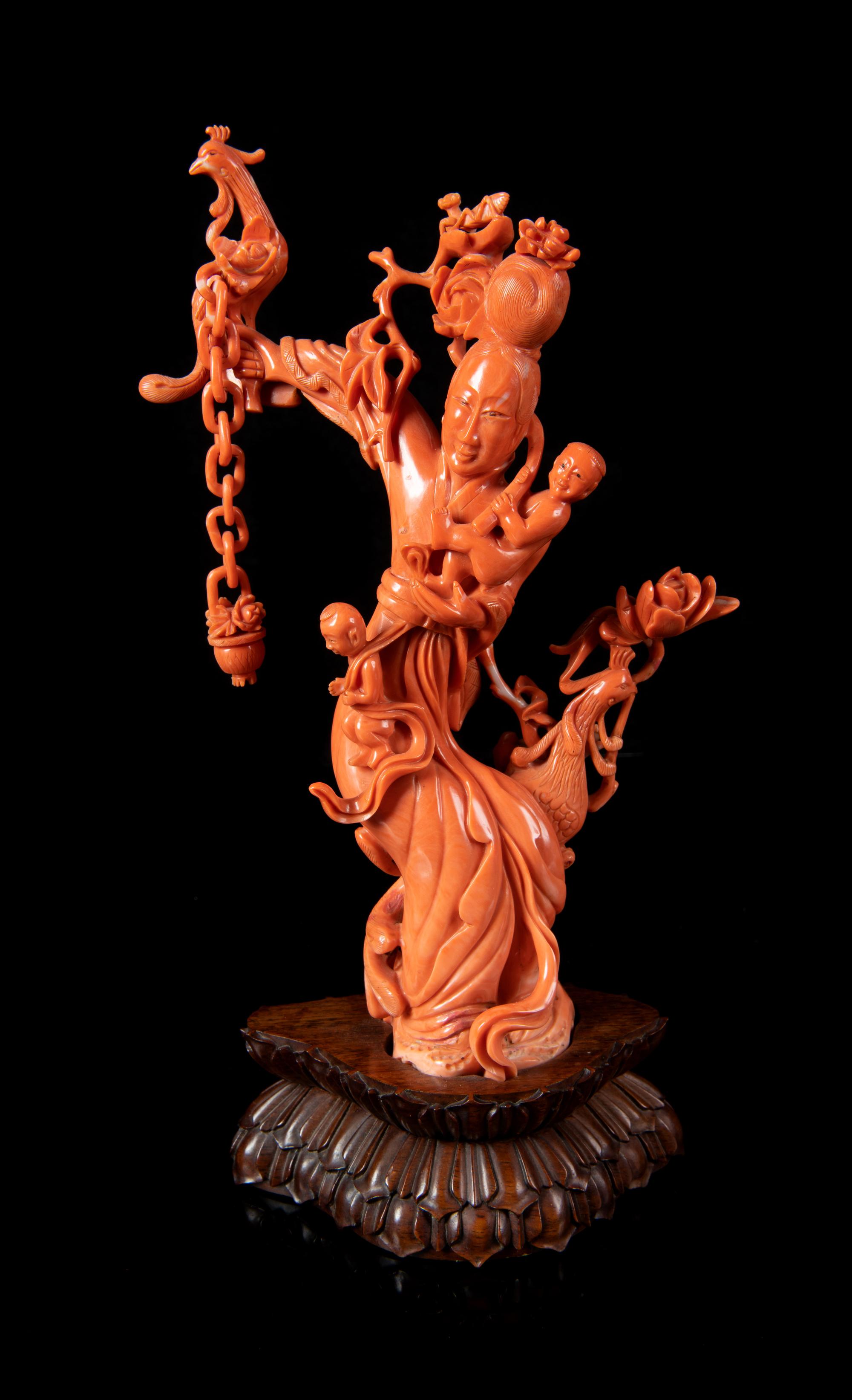 A Red Coral Figural Group of a Female Immortal and Two Boys