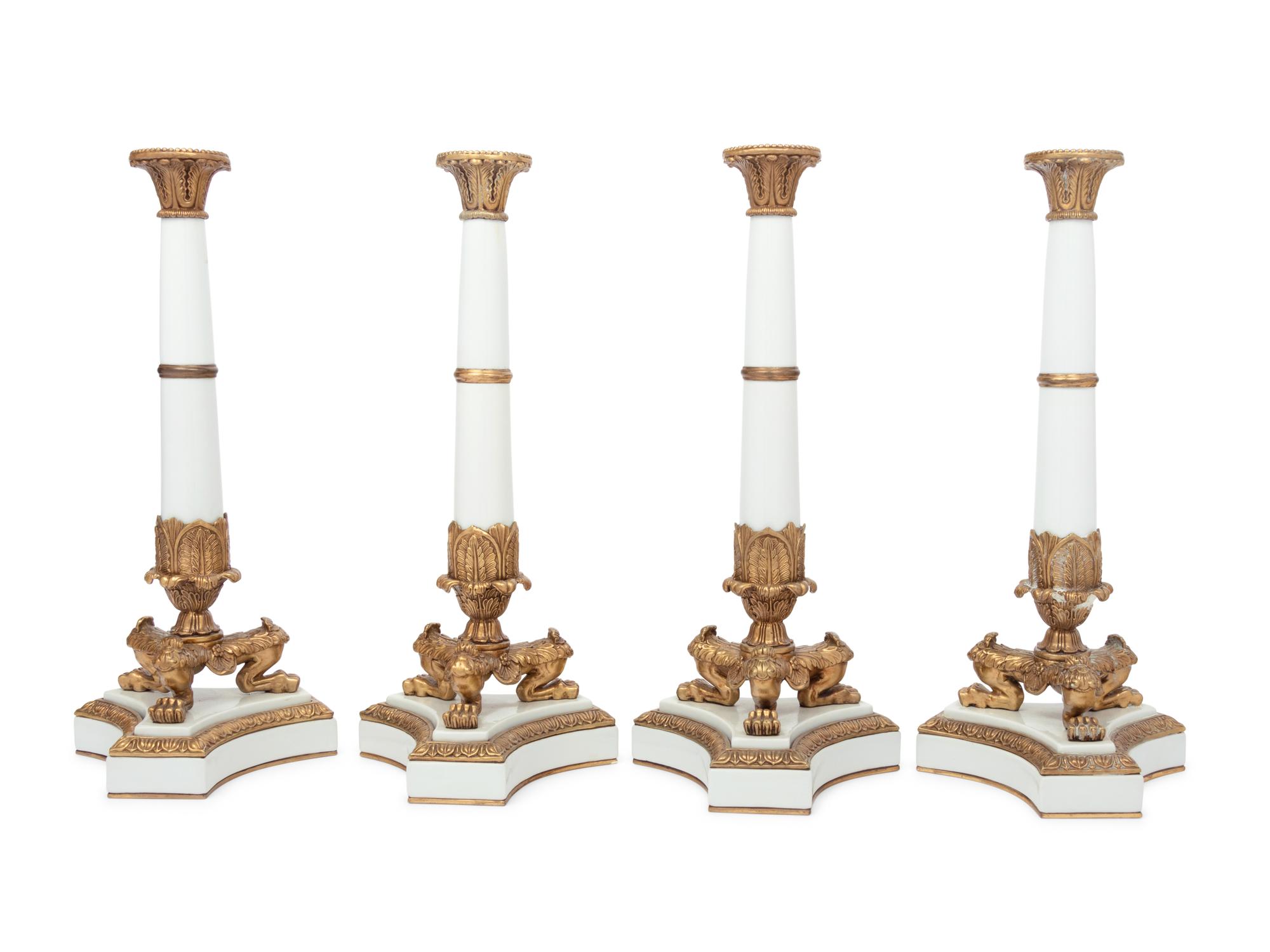 A Set of Four Contemporary Empire Style Gilt Metal Mounted Porcelain Candlesticks