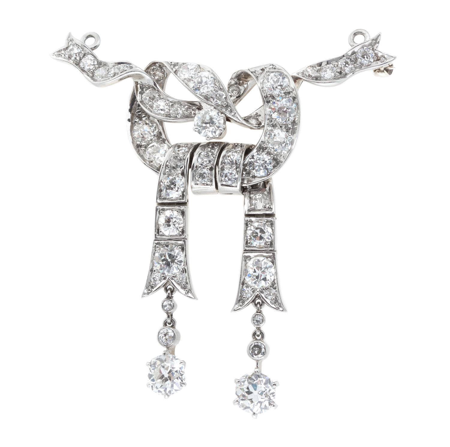 An Edwardian Platinum Topped Gold and Diamond Bow Brooch, 12.60 dwts.