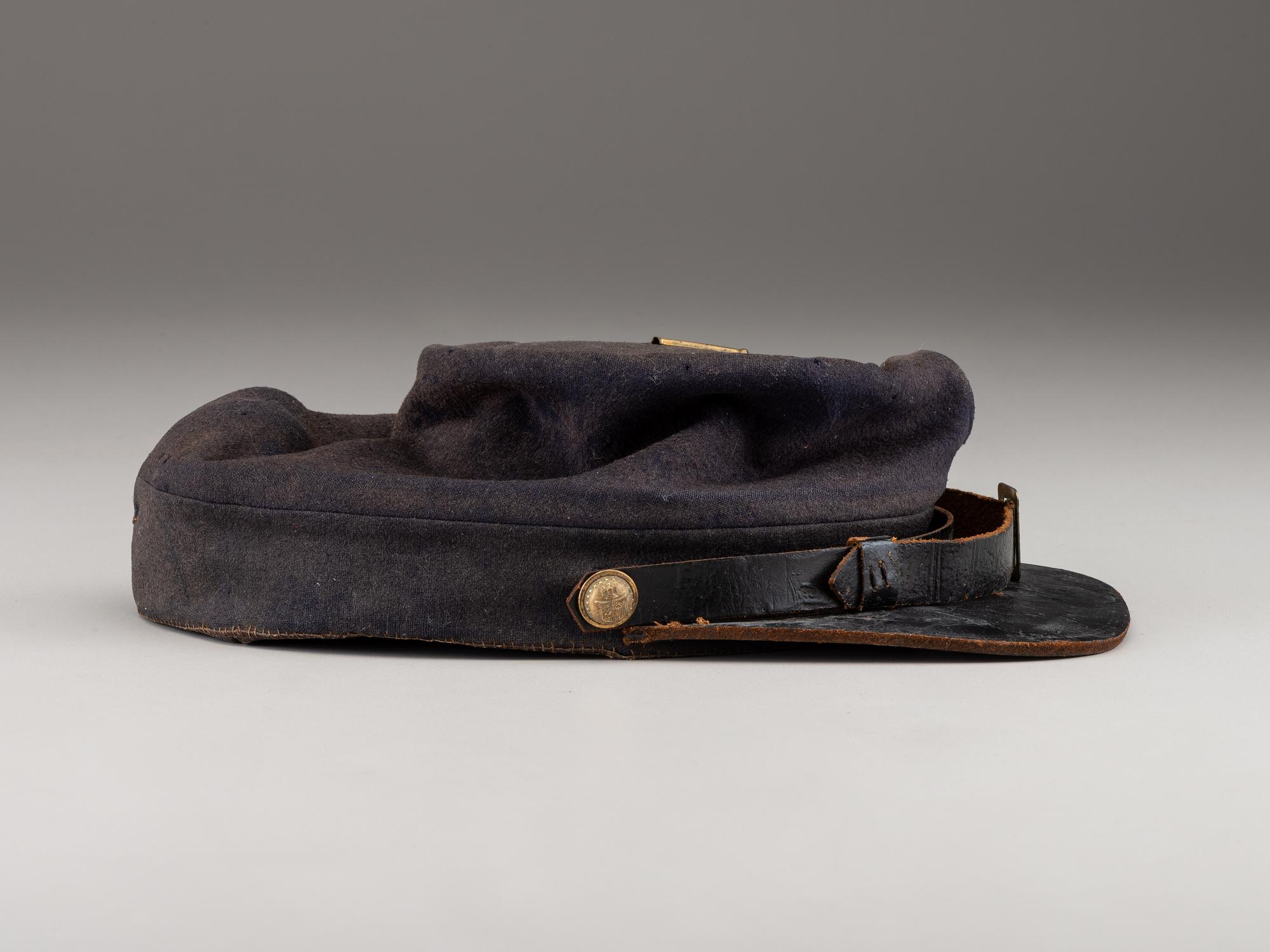 [CIVIL WAR]. A collection of items identified to brothers Robert and Samuel Burnside, Company H, 110th New York Infantry, comprised of a kepi and war-date photographs.