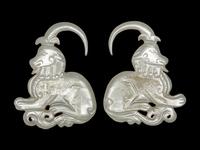 A Pair of Greyish Celadon Jade 'Ram' Earrings