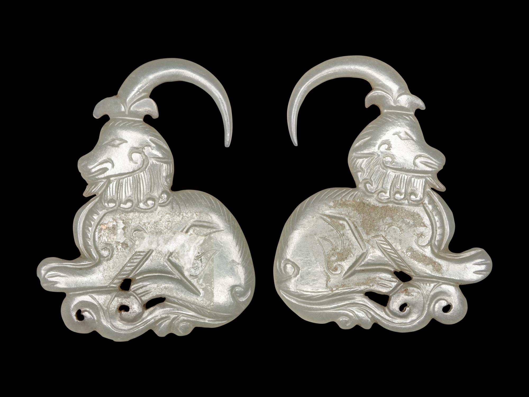 A Pair of Greyish Celadon Jade 'Ram' Earrings