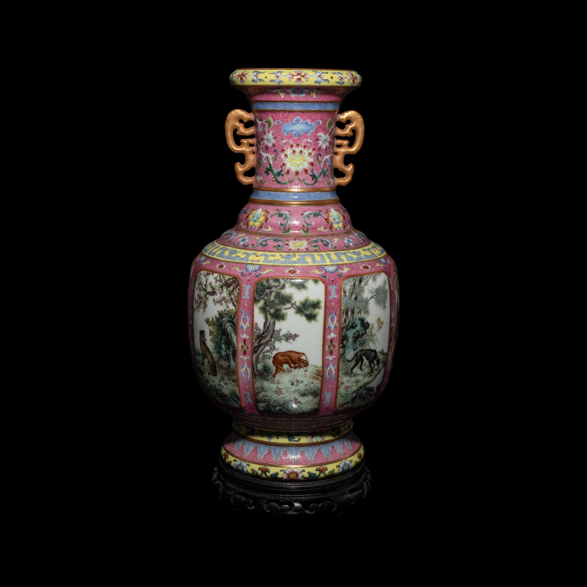 A Chinese Pink Sgraffito Ground Famille Rose Porcelain 'Dogs' Vase, Early-Mid 20th Century — 近現代 胭脂地軋道粉彩纏枝蓮紋開光獵犬圖雙耳瓶 帶木座