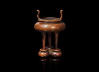A Chinese patinated copper alloy tripod censer and stand, apocryphal "Xuan" mark 銅爐及底座 宣款
