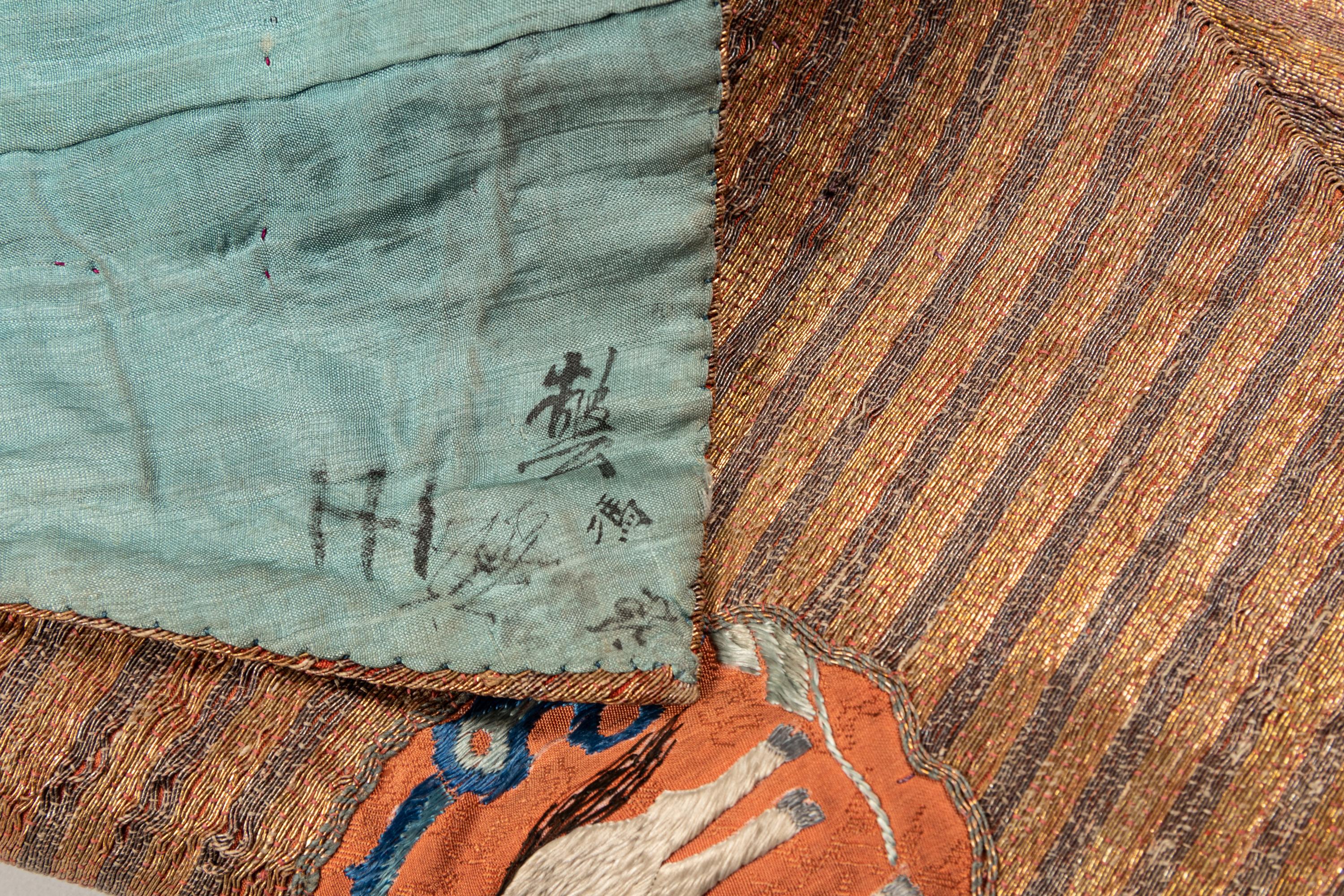 An Apricot Ground Embroidered Silk Lady’s Informal Robe