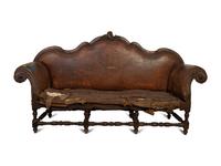 A Spanish Baroque Carved Walnut Leather-Upholstered Sofa — 17TH/18TH CENTURY