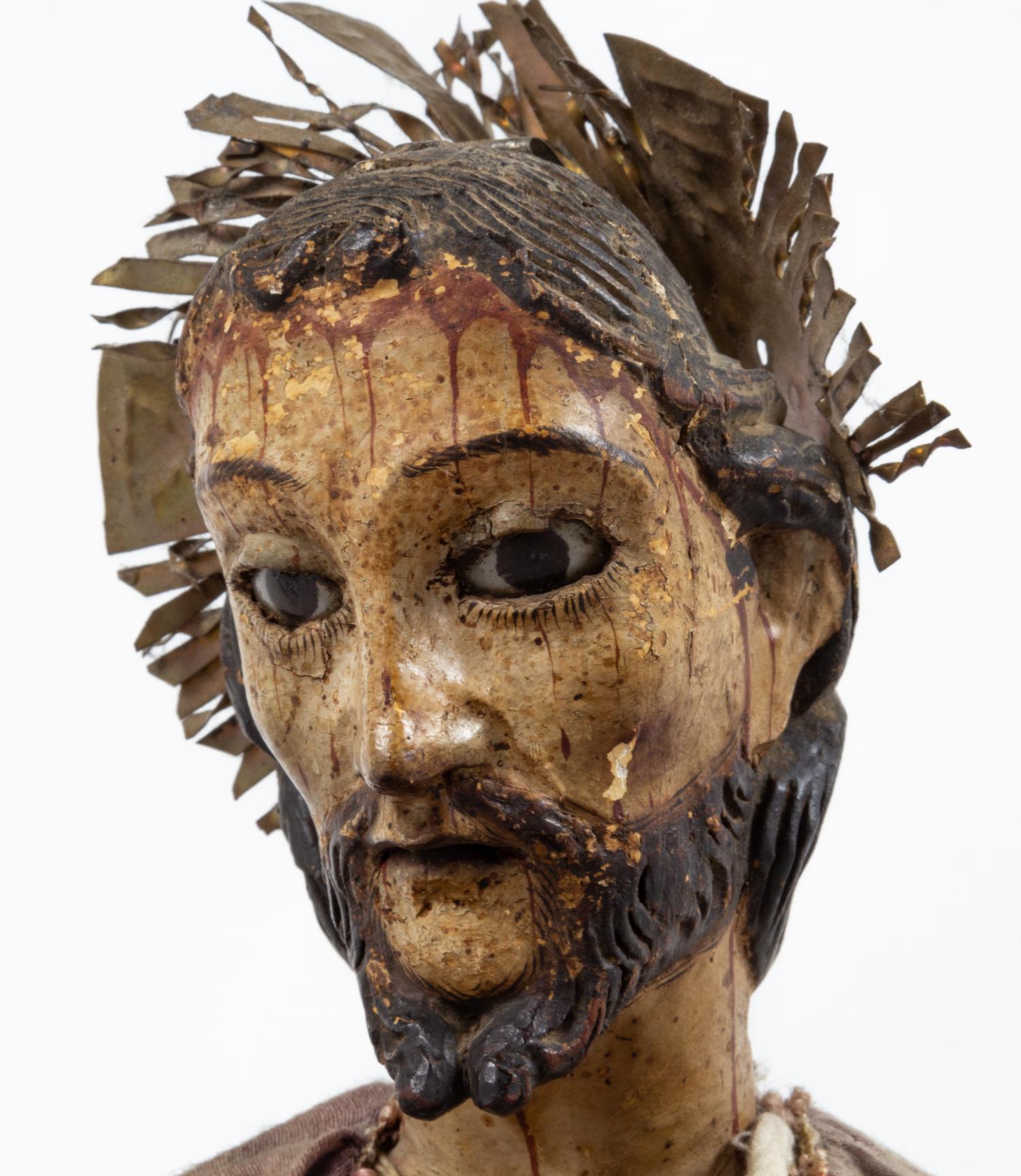 A Continental Painted Figure of a Saint
