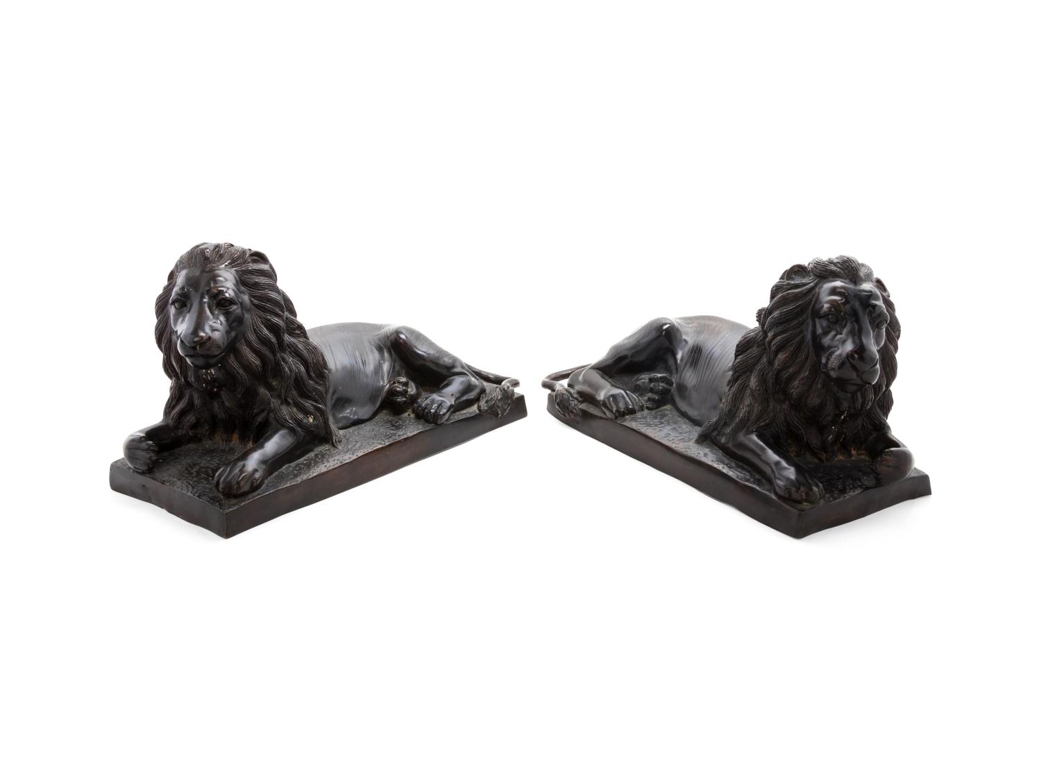 A Pair of Bronze Models of Recumbent Lions
