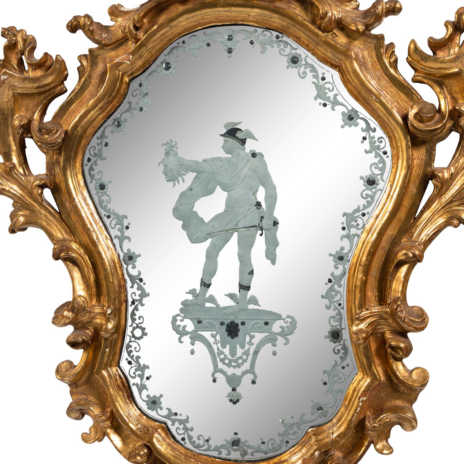 An Italian Baroque Style Giltwood and Etched Glass Mirror