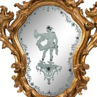 An Italian Baroque Style Giltwood and Etched Glass Mirror