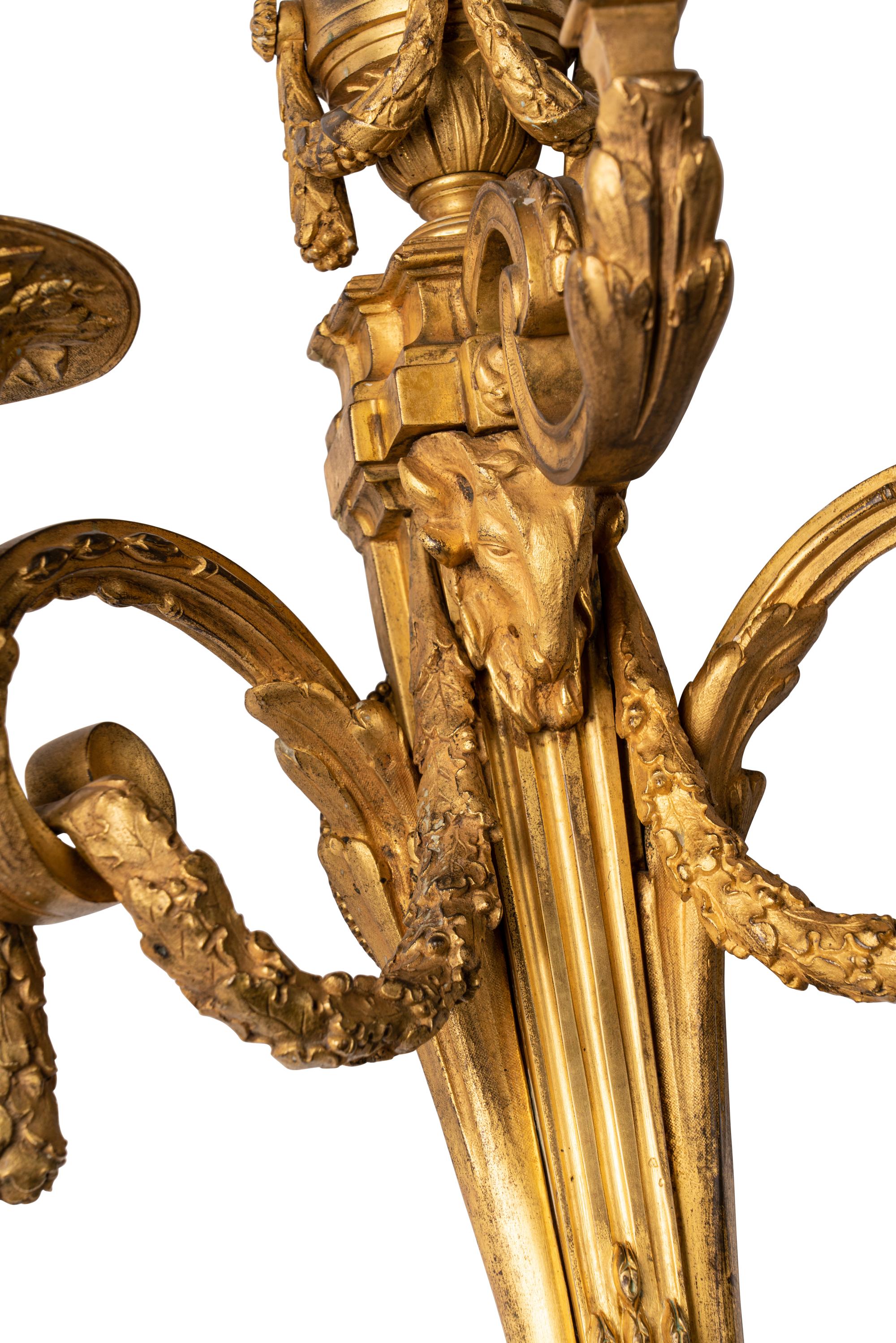 A Pair of Louis XVI Style Gilt Bronze Three-Light Sconces