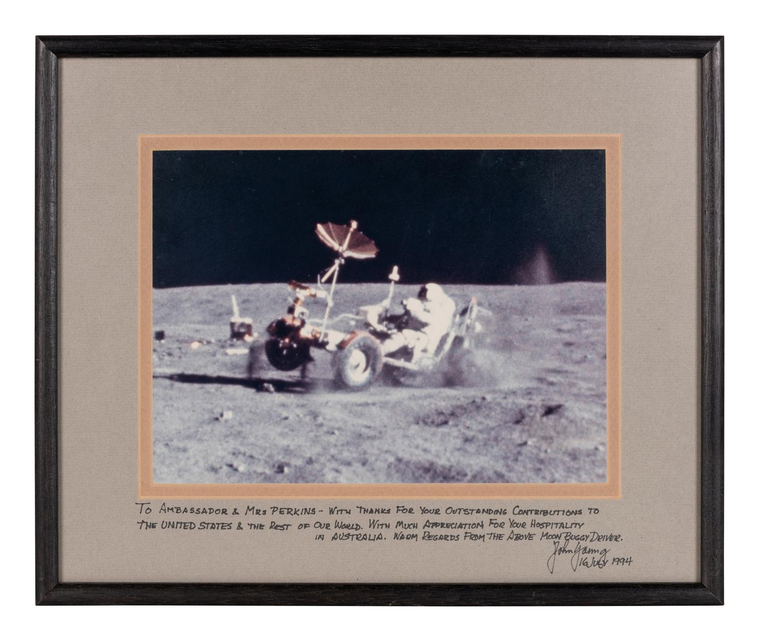 YOUNG, John Watts (1930-2018). Photograph of Young driving a moon buggy, signed (“John Young”) to Ambassador Edward Joseph Perkins.