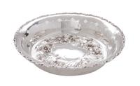 An American Silver Nut Dish, MAUSER MFG. CO, NEW YORK, of circular form having pierced sides and gadrooned rim, with face of a female f