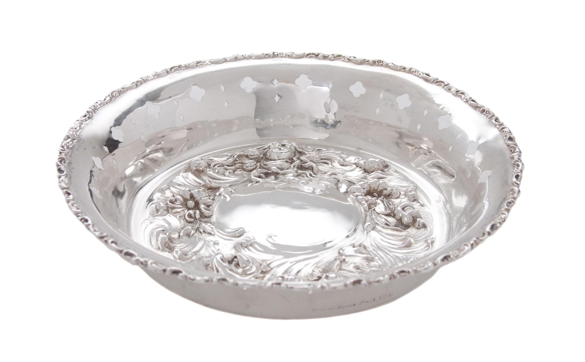 An American Silver Nut Dish, MAUSER MFG. CO, NEW YORK, of circular form having pierced sides and gadrooned rim, with face of a female f