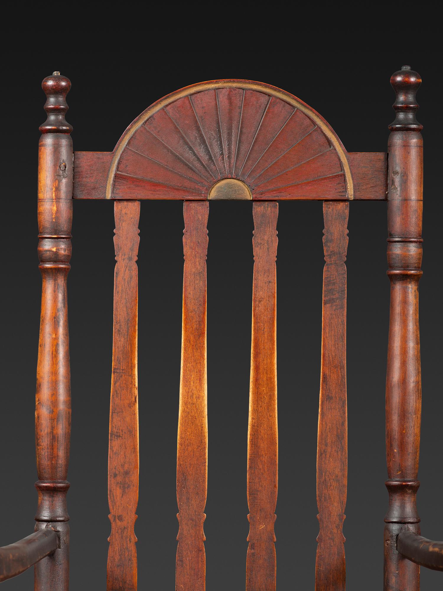 A William and Mary Style Parcel Gilt and Red Painted, Fan-Carved Bannister Back Woven Splint Seat Armchair