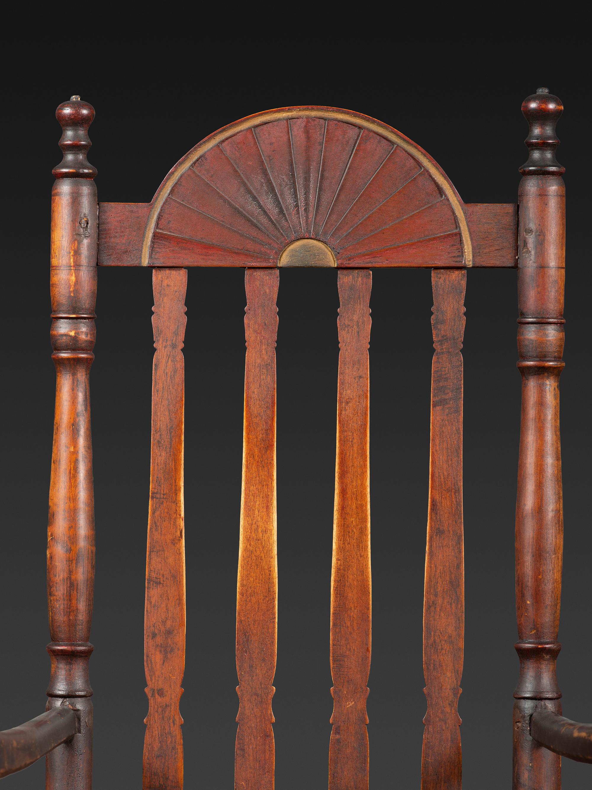 A William and Mary Style Parcel Gilt and Red Painted, Fan-Carved Bannister Back Woven Splint Seat Armchair