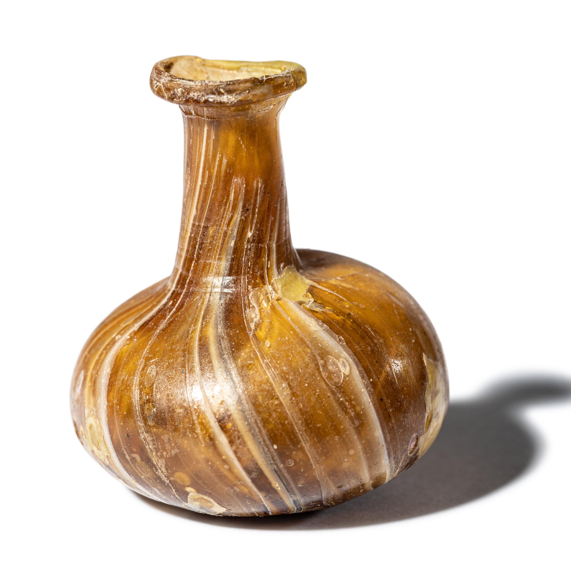 A Roman Marbled Yellow Glass Bottle