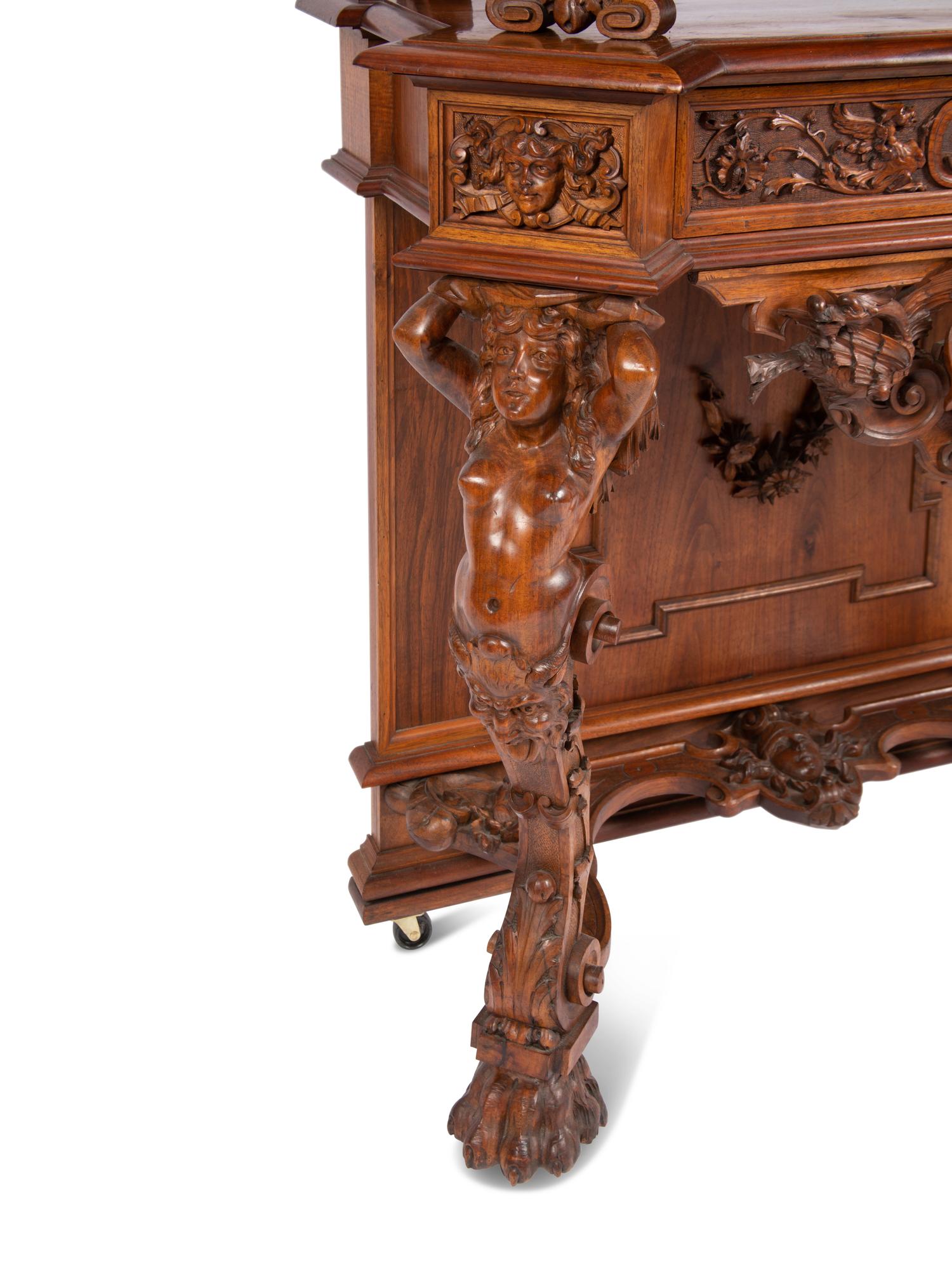 A Renaissance Revival Carved Walnut Cabinet In the Manner of Alexander Roux