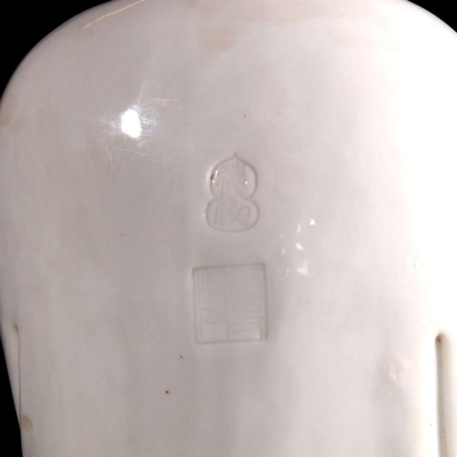 A Chinese blanc de chine figure of Guanyin 德化窑观音造像 "Dehua" and "Puji Yuren" mark ”??“ ? “????” ??
