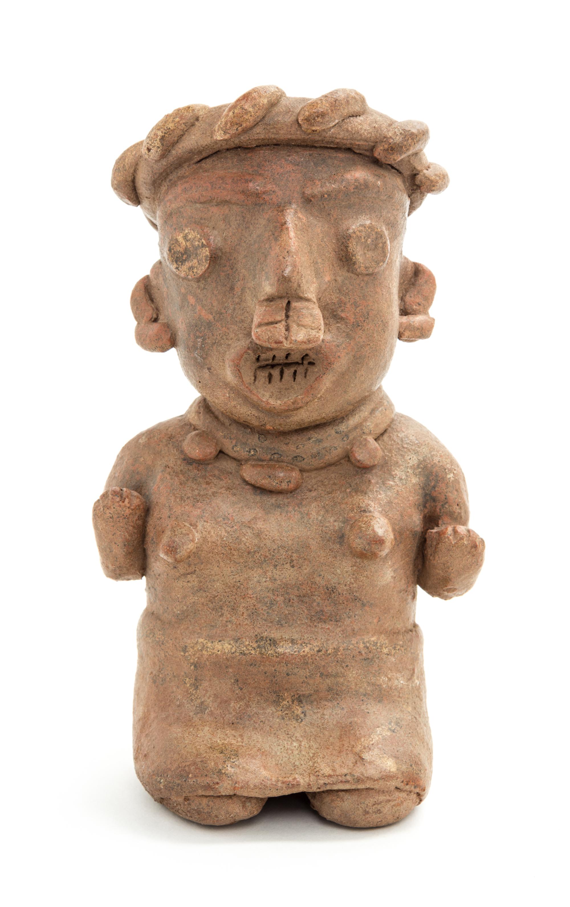A Mexican Nayarit Polished Earthenware Figure of a Seated Female. Height 7 x width 4 x depth 3 inches.