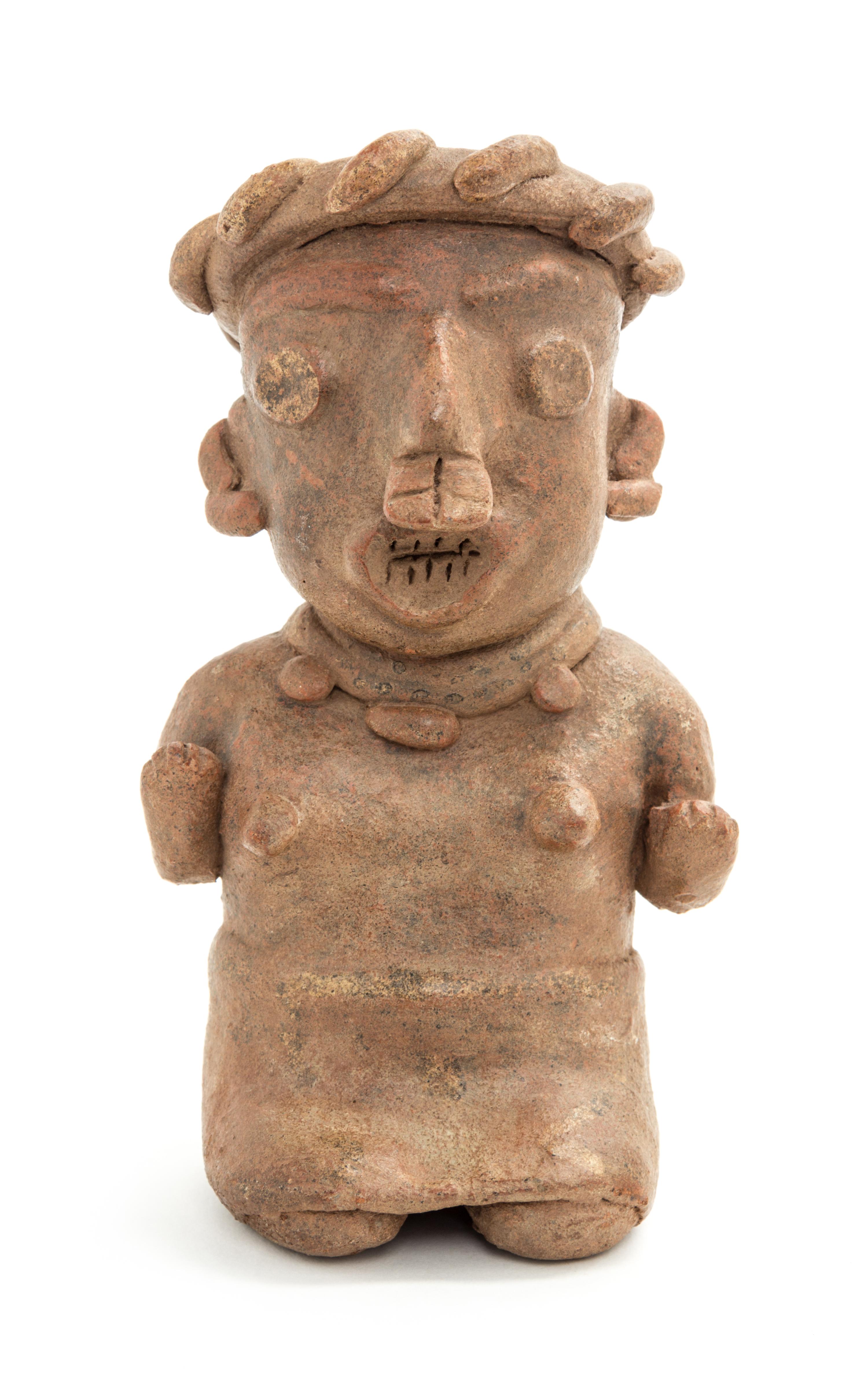 A Mexican Nayarit Polished Earthenware Figure of a Seated Female. Height 7 x width 4 x depth 3 inches.