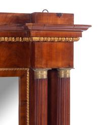 An Italian Gilt Bronze Mounted and Parcel Gilt Mahogany Overmantel Mirror
