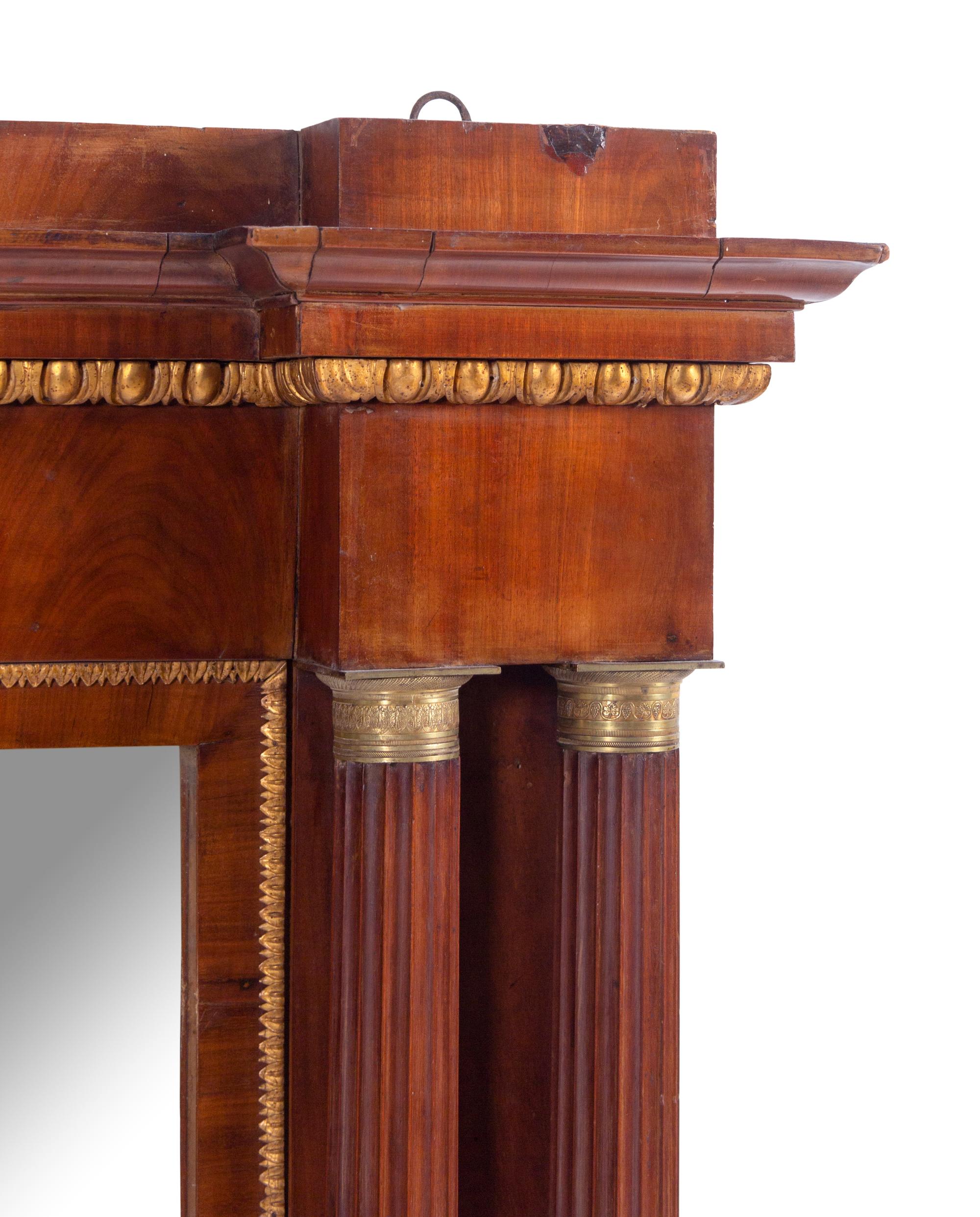 An Italian Gilt Bronze Mounted and Parcel Gilt Mahogany Overmantel Mirror
