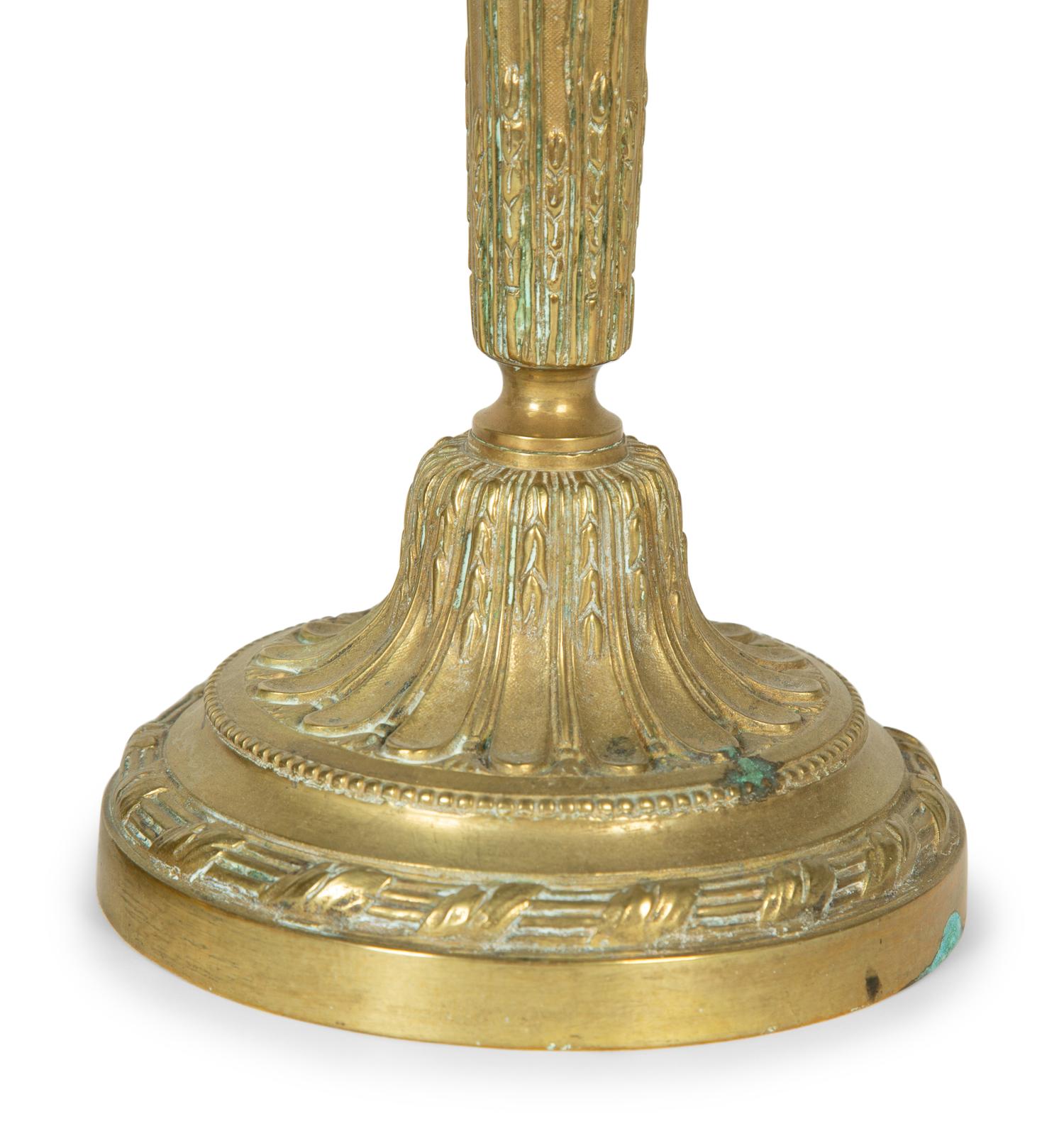 A Pair of Continental Brass Candlesticks