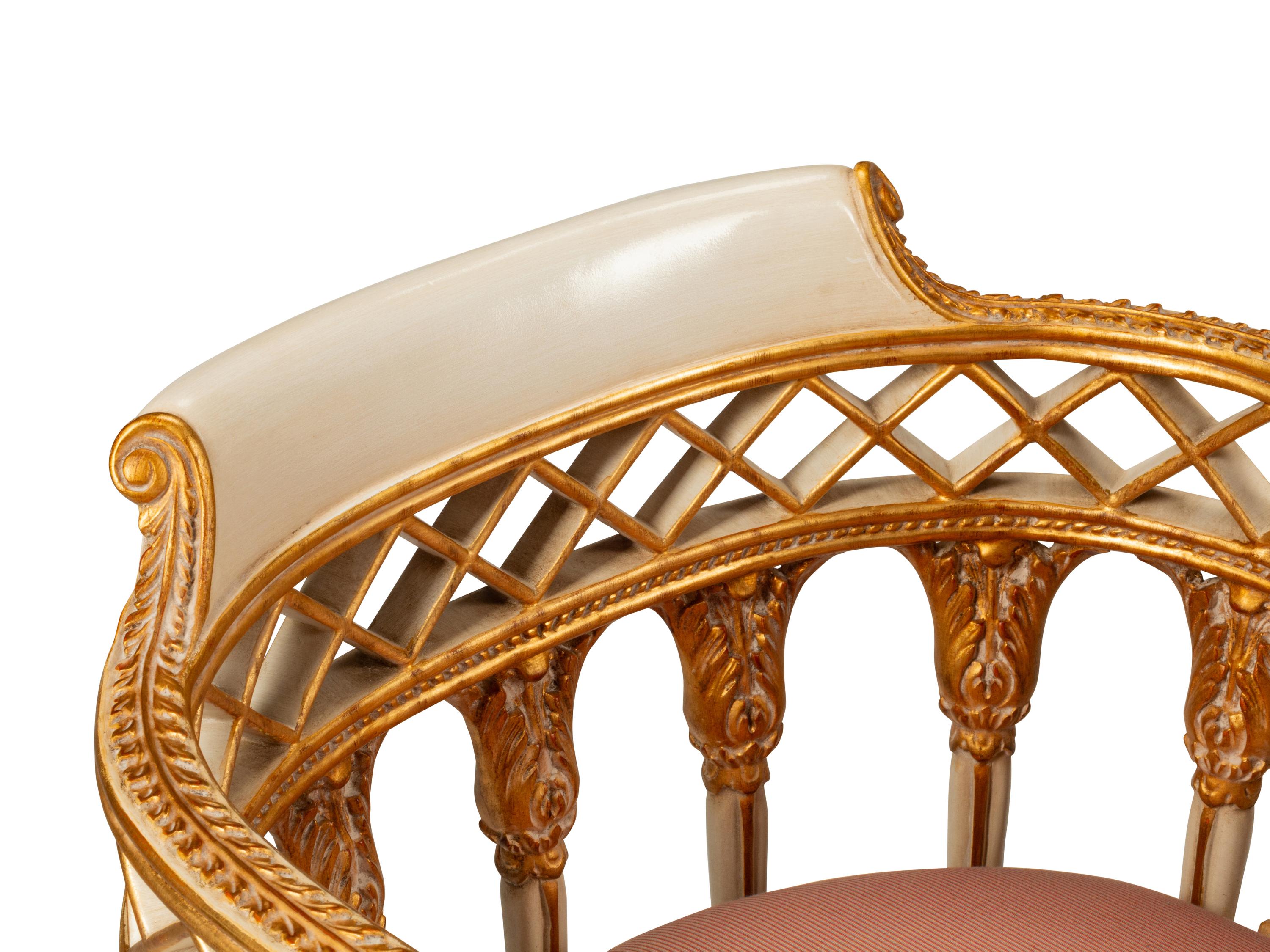 A Pair of Italian Neoclassical Style White-Painted and Parcel Gilt Armchairs