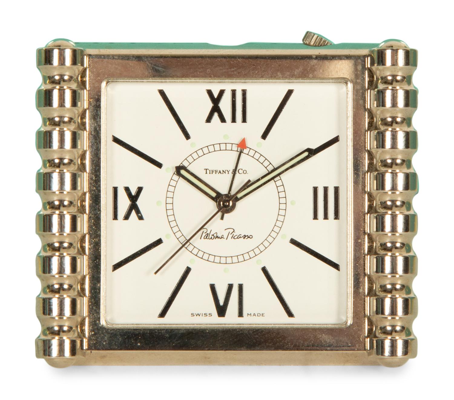 A Tiffany and Co. Travel Clock and Three Sets of Playing Cards
