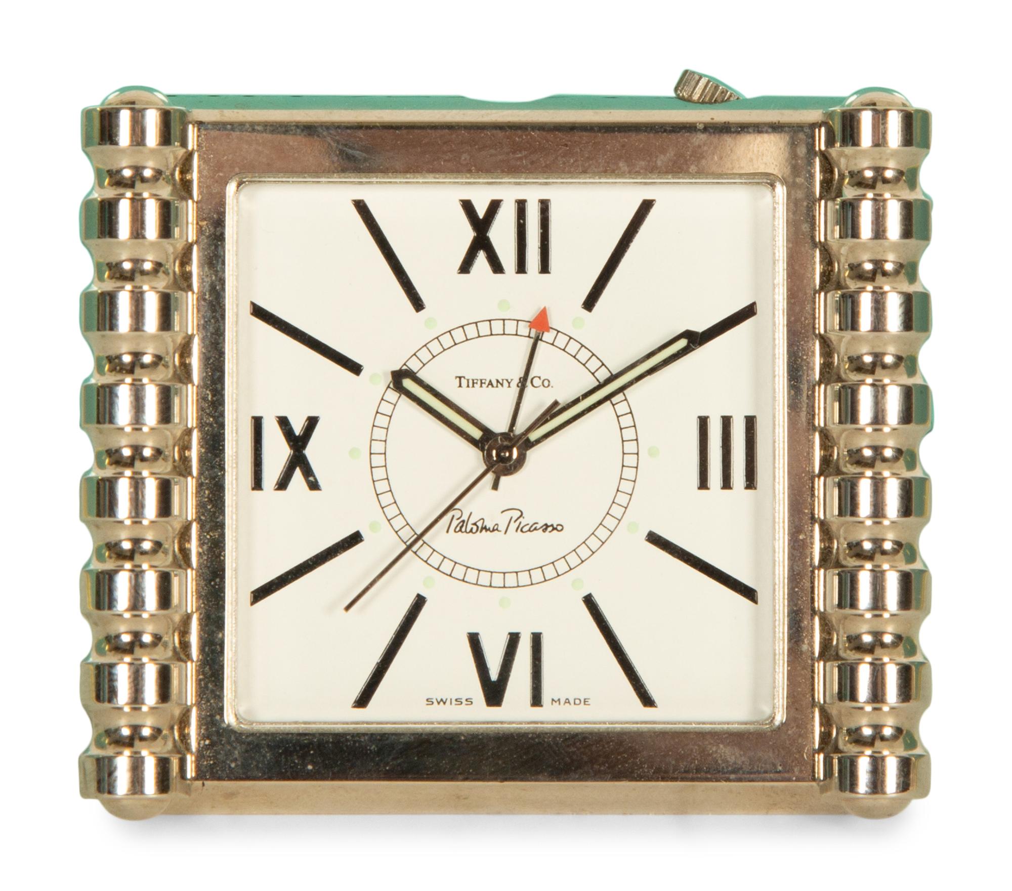 A Tiffany and Co. Travel Clock and Three Sets of Playing Cards