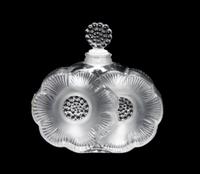 A Lalique Molded and Frosted Glass Perfume Bottle Height 3 3/4 inches.