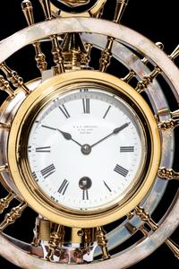 An English Steel and Brass Ship's Wheel Clock and Barometer, E&E Emanuel