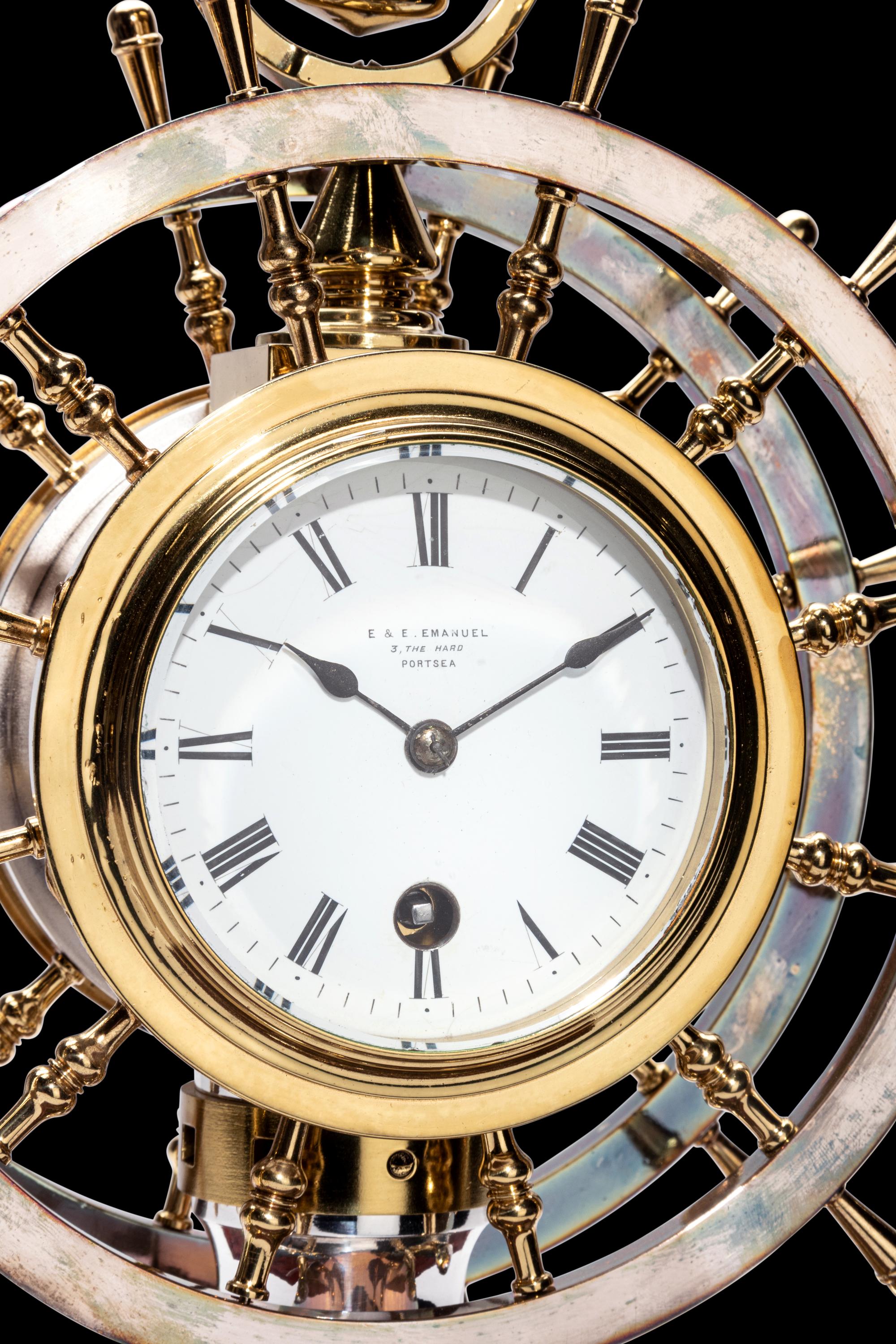 An English Steel and Brass Ship's Wheel Clock and Barometer, E&E Emanuel