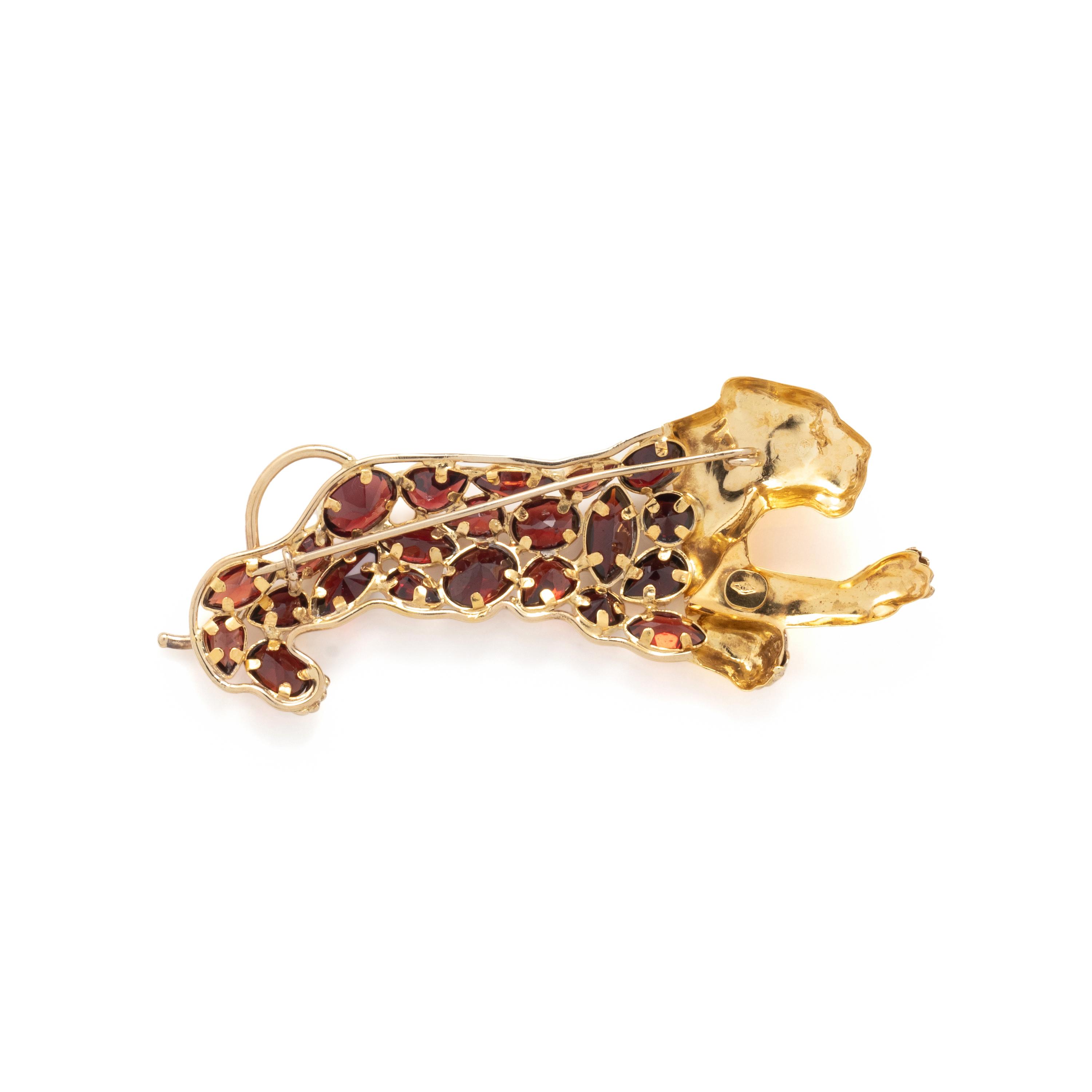YELLOW GOLD AND GARNET LEOPARD BROOCH