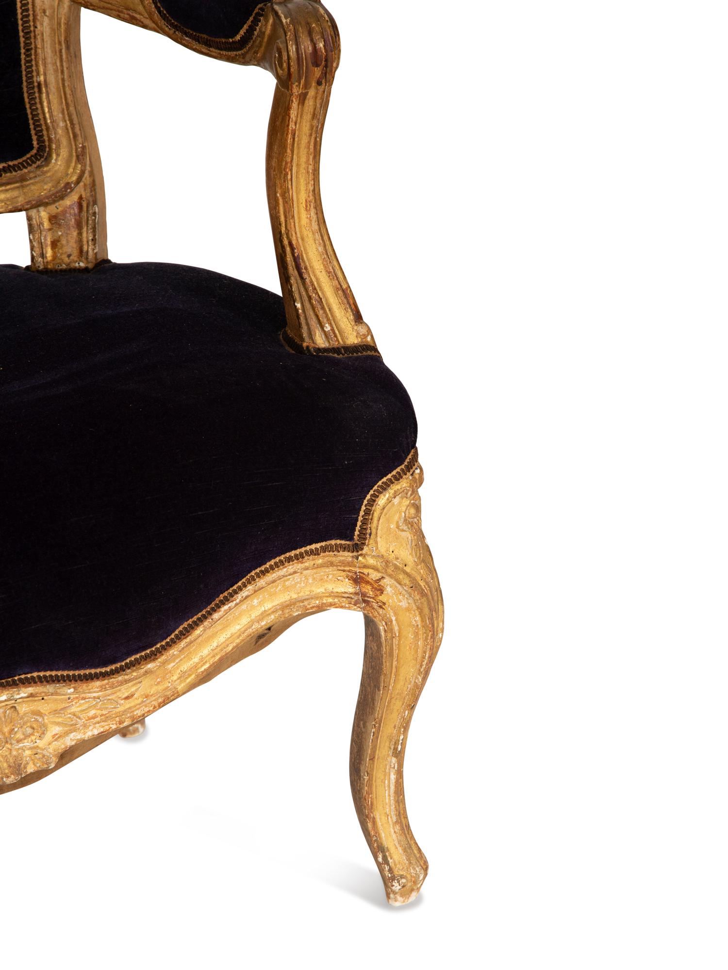 A Pair of Louis XV Giltwood Fauteuils