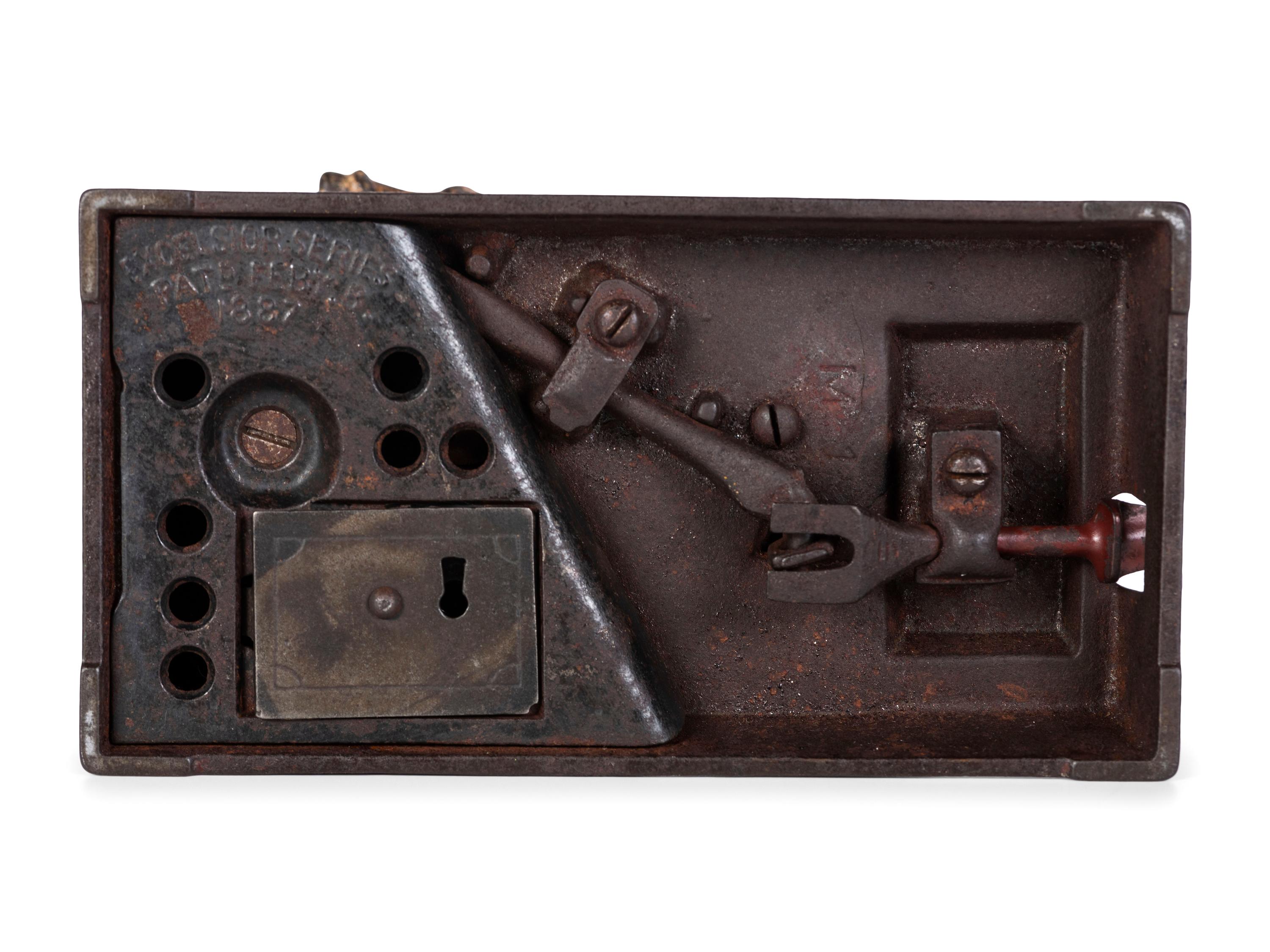 A Shephard Hardware Excelsior Series 'Mason' Cast Iron Mechanical Bank