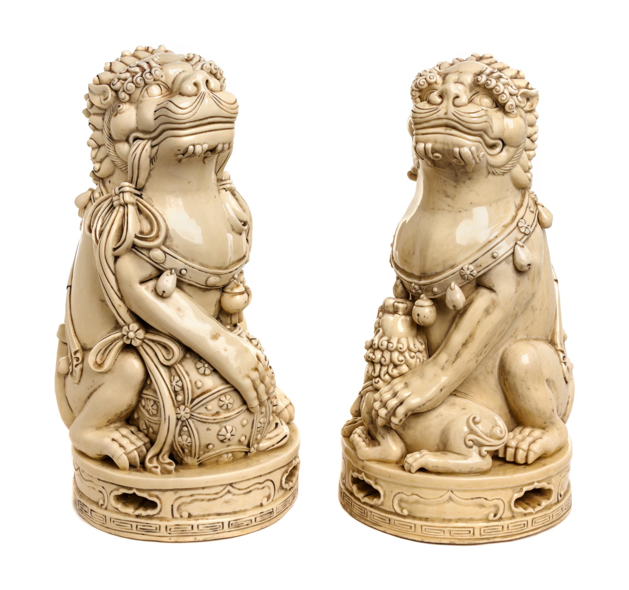 A Pair of Chinese Ceramic Fu Dogs Height 13 1/4 inches. — 20TH CENTURY