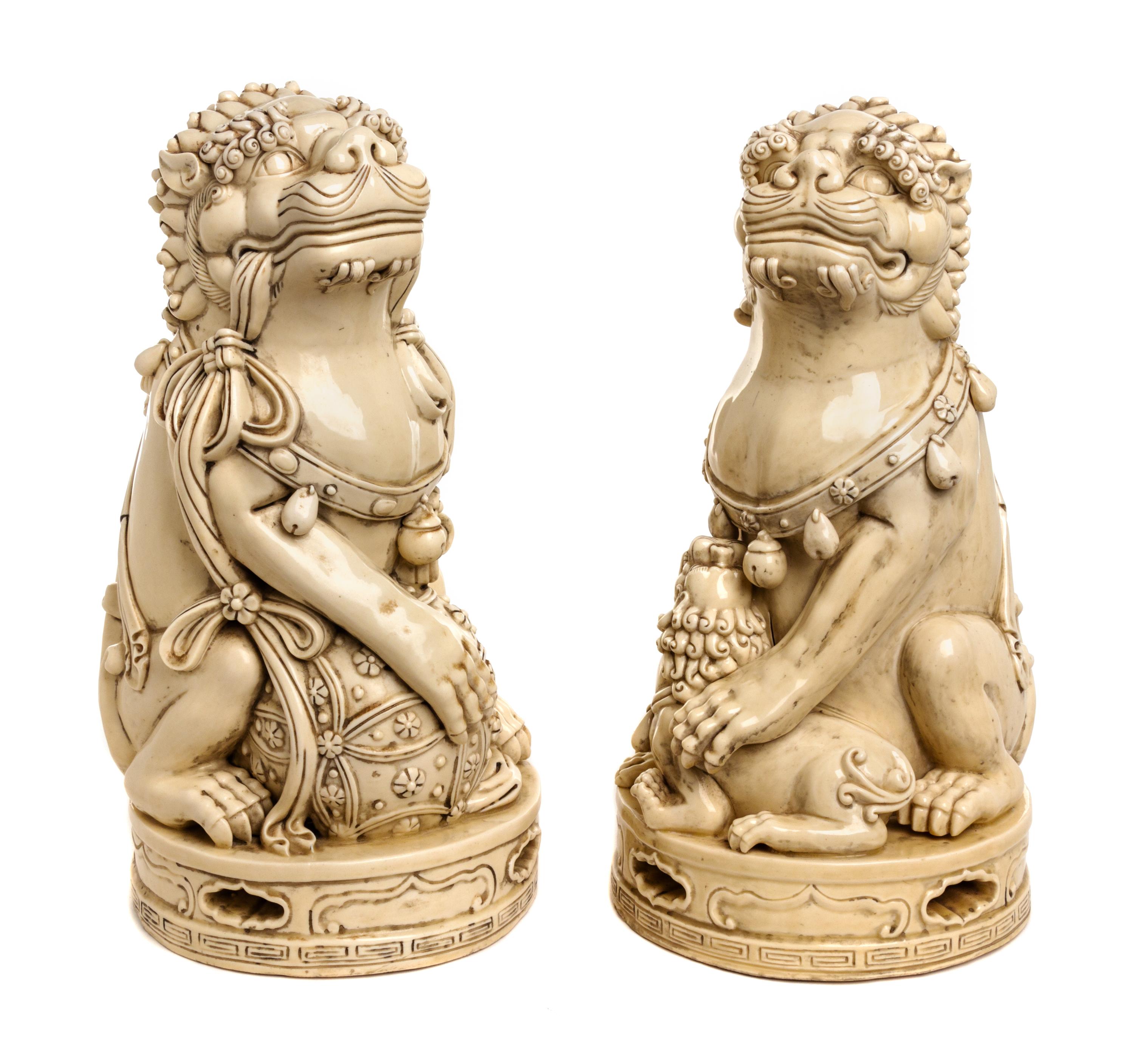 A Pair of Chinese Ceramic Fu Dogs Height 13 1/4 inches. — 20TH CENTURY
