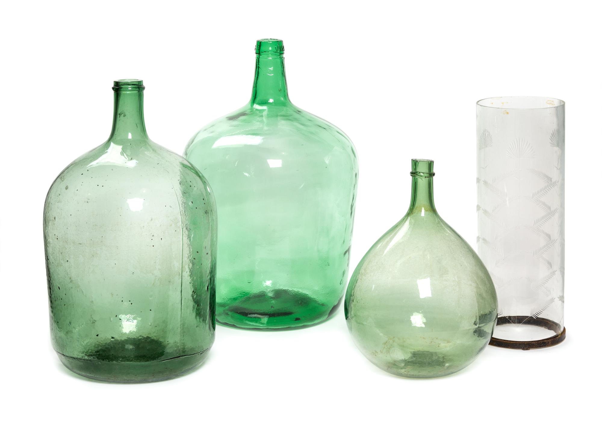 A Group of Three Blown Glass Wine Jugs Height of tallest 22 inches.
