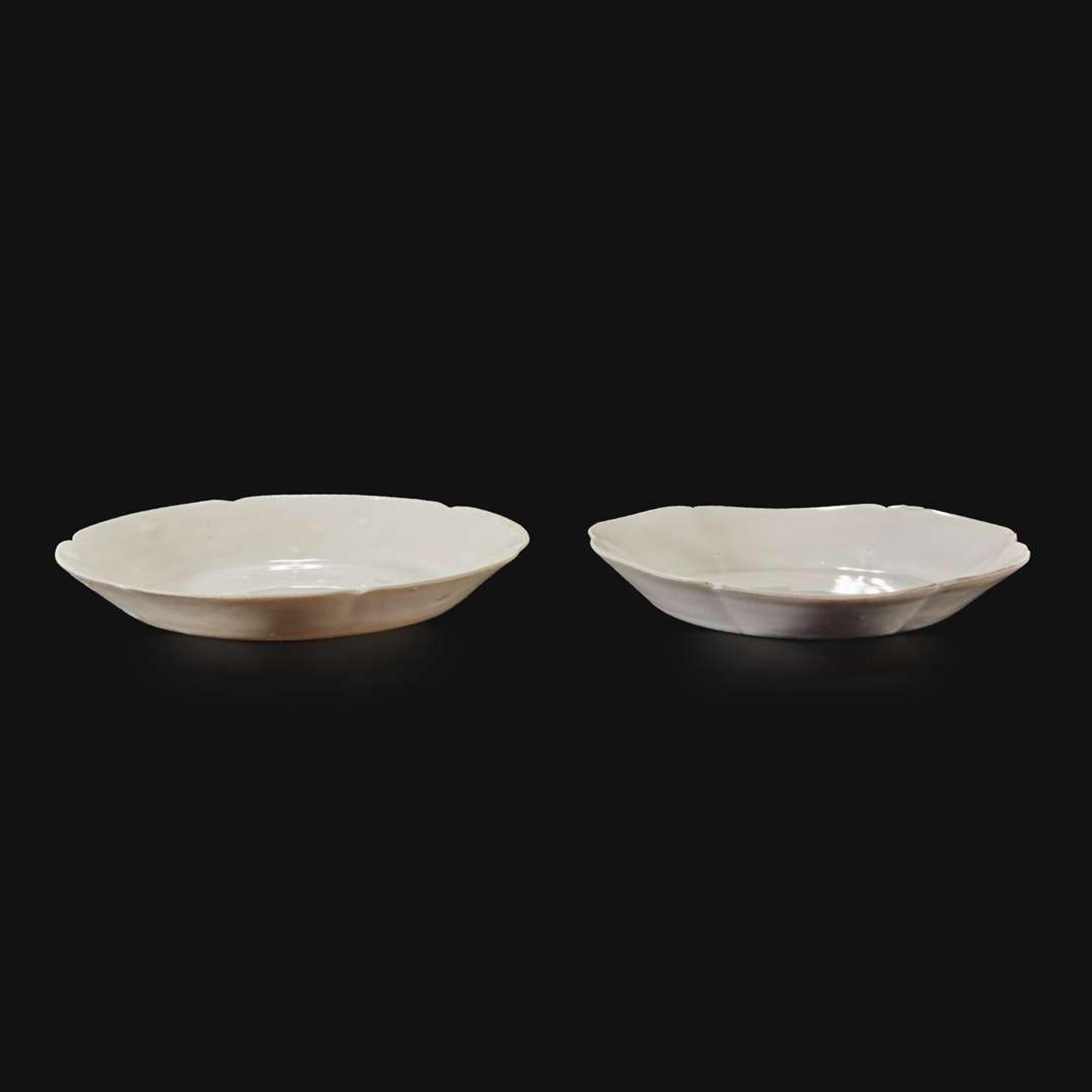 An associated pair of Chinese whiteware floriform dishes Song dynasty