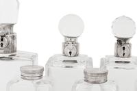 Seven Silver and Silver-Plate Mounted Glass Decanters