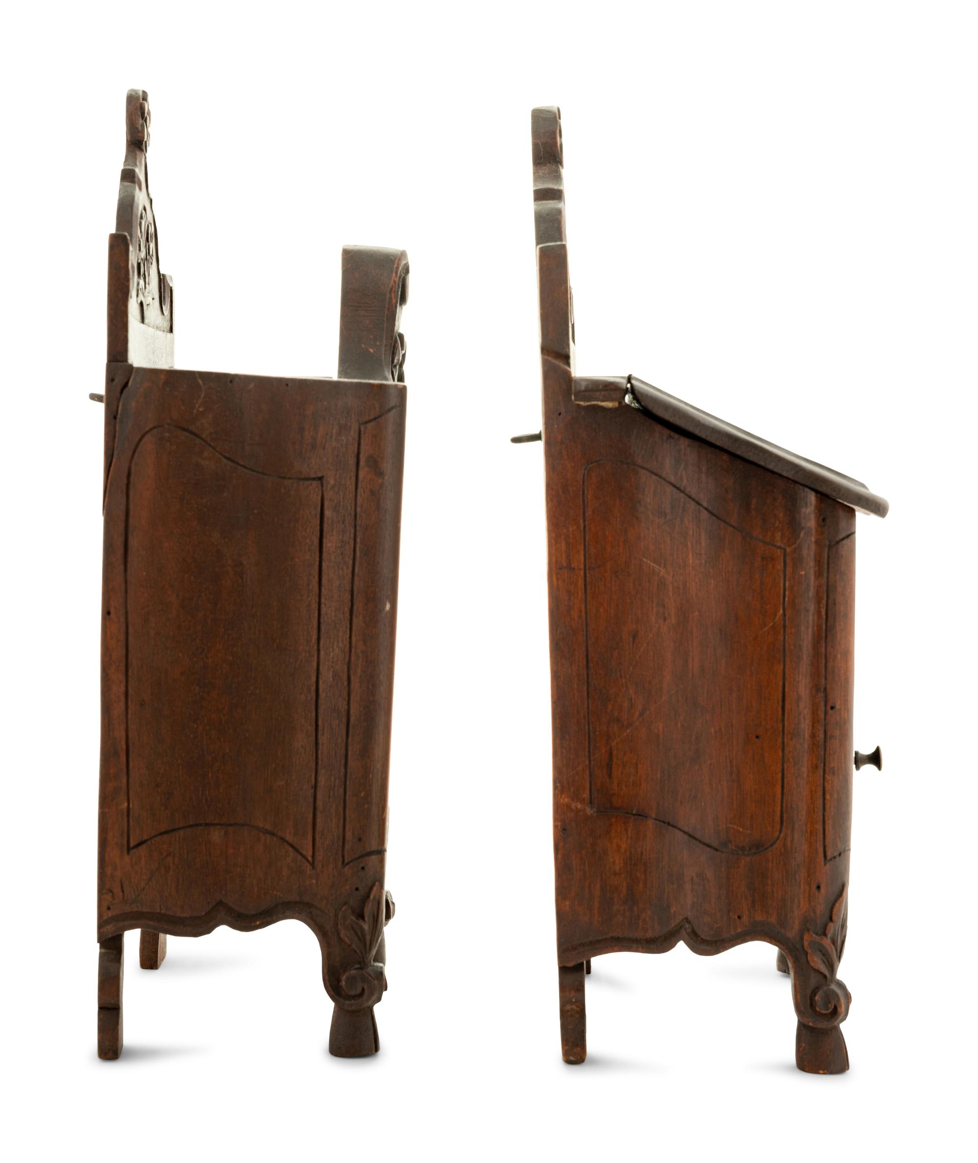 A Pair of French Provincial Walnut Hanging Salt Boxes
