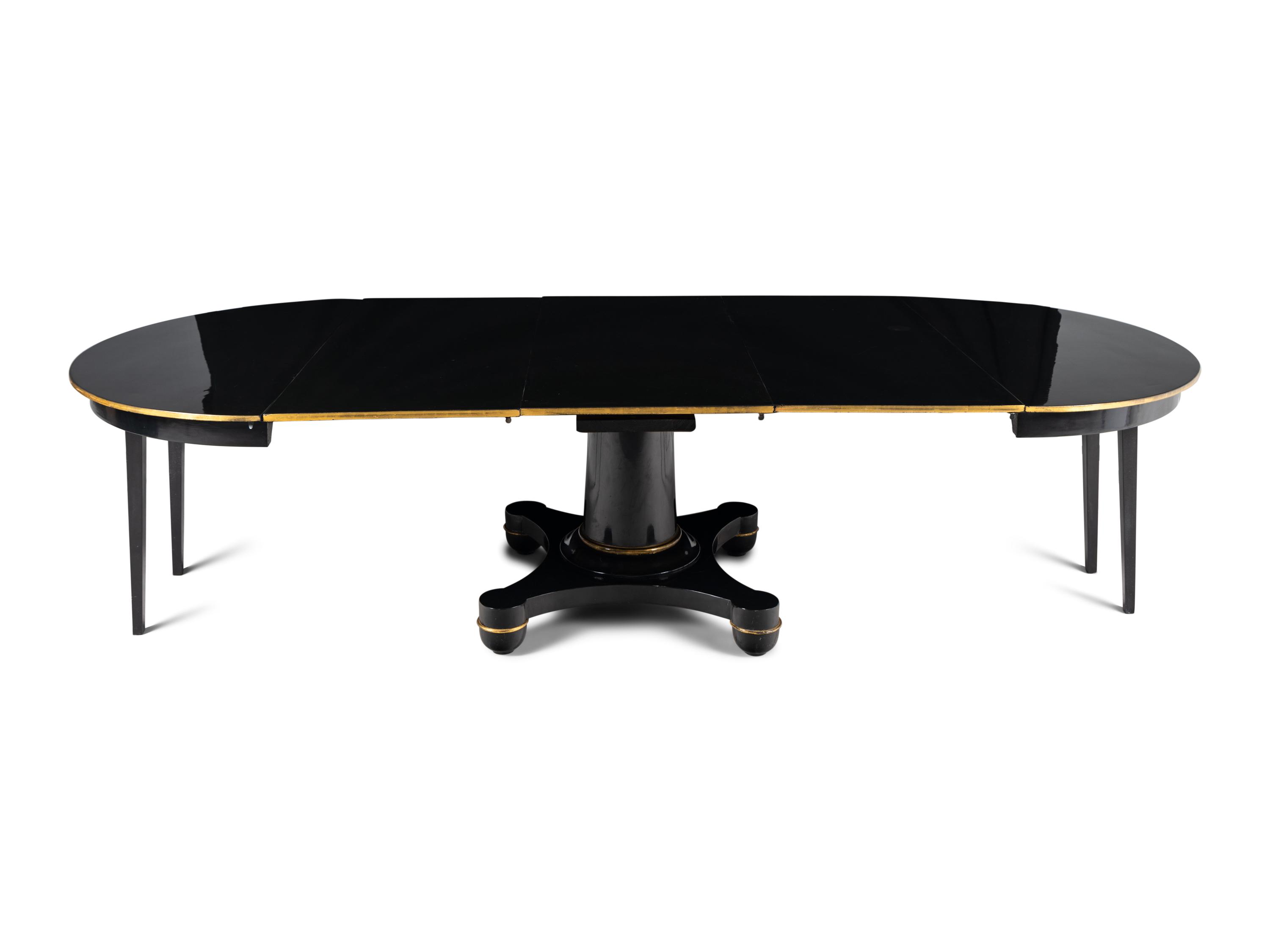 A Biedermeier Black Painted and Parcel-Gilt Pedestal Dining Table