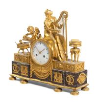 An Empire Gilt Bronze and Marble Figural Mantel Clock